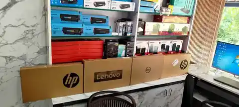 Laptop cartons and technology accessories displayed at Ultimate Computers, Kumta